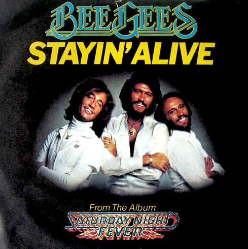 Stayin alive текст. Stayin' Alive Bee Gees ремикс. Staying Alive Bee Gees. Bee Gees. Stayin' Alive Рассел Кроу. Stayin Alive песня.